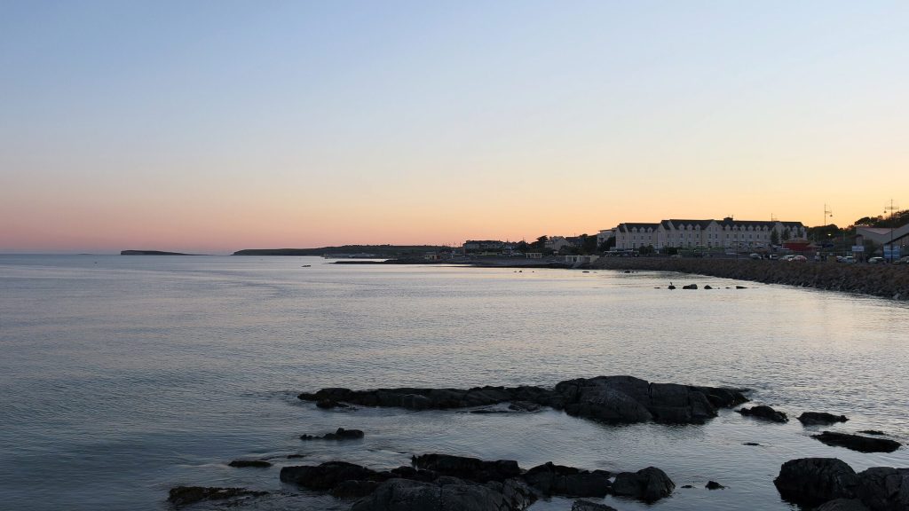 Calm water and the Salthill promenade at dusk, Galway Bay
